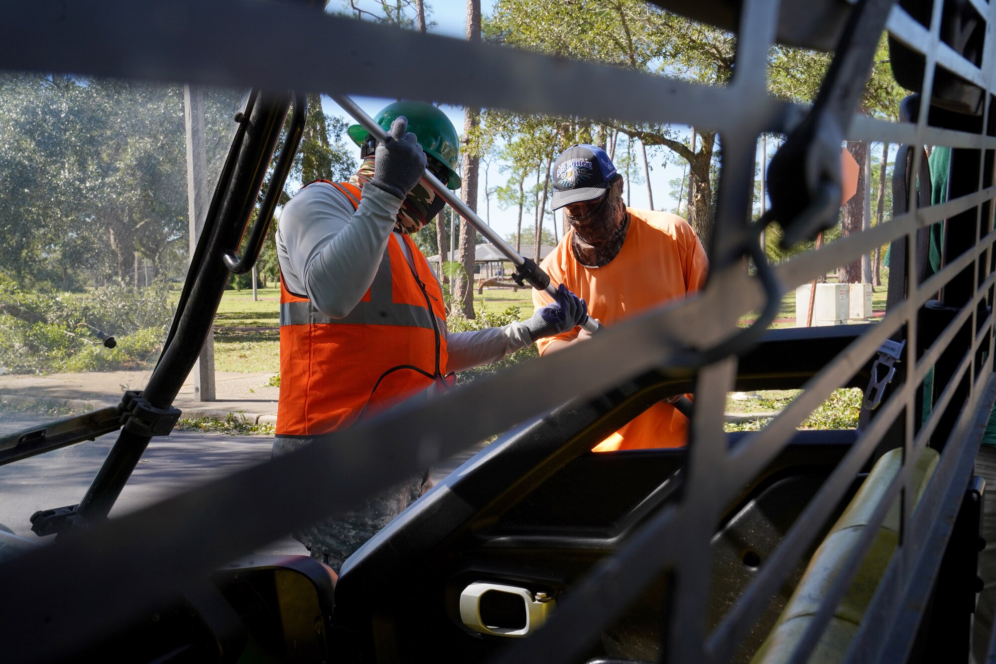 Franchot Canaan and Adan Cardoza, Vectrus ground landscaping maintainers, prepare equipment to clean up debris at Keesler Air Force Base, Mississippi, Oct. 29, 2020. Members of the 81st Civil Engineering Squadron and Vectrus worked before, during and after Hurricane Zeta to ensure the base infrastructure was able to sustain the wind and rain during the storm. (U.S. Air Force photo by Airman 1st Class Seth Haddix)