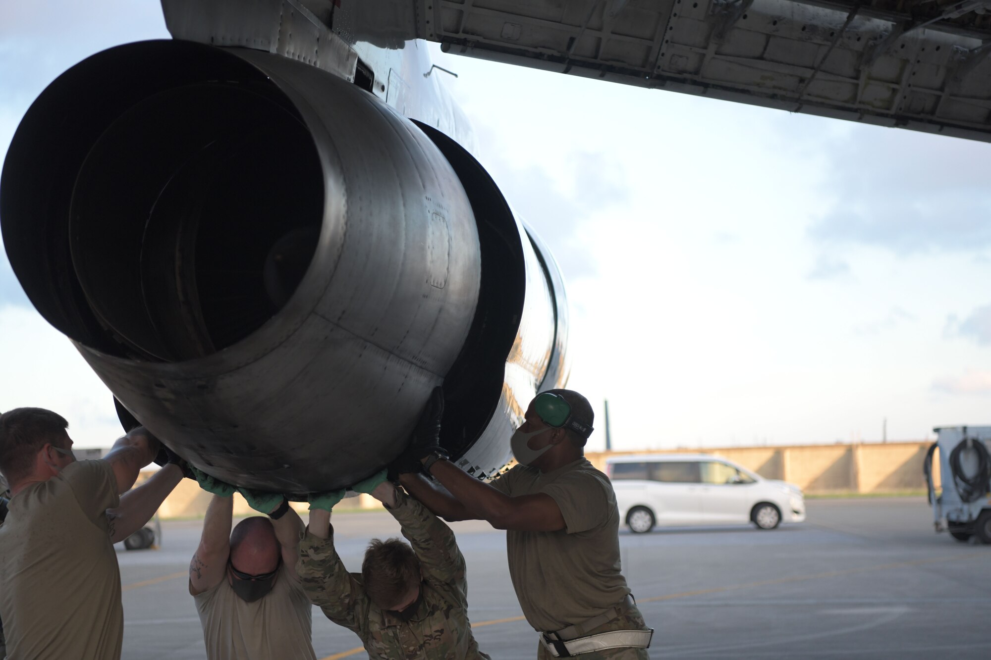 5th Expeditionary Airborne Command and Control Squadron Joint Surveillance Target Attack Radar System team members work together to remove outer engine components of an E-8C Joint STARS aircraft at Kadena Air Base, Japan, Sept. 24, 2020. The Air National Guard and active duty members from Robins Air Force Base, Georgia, are on three-month rotations to work with the 5th EACCS on KAB to promote total force integration and joint interoperability. (U.S. Air Force photo by Airman 1st Class Rebeckah Medeiros)