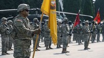 U.S. Army Spc. Tala Faasavalu, assigned to the 4th Squadron, 2d Cavalry Regiment, holds regimental unit colors during the opening ceremony for the Noble Partner 20 exercise in Vaziani Military Base, Georgia, Sept. 7, 2020. Exercise Noble Partner is designed to enhance regional partnerships and increase U.S. force readiness and interoperability in a realistic, multinational training environment. The exercise allows participants to conduct situational training exercises, live-fire exercises and combined mechanized maneuvers. The 4th Squadron, 2d Cavalry Regiment (Sabers) will lead the exercise for 2d Cavalry Regiment. (U.S. Army photo by Sgt. LaShic Patterson)