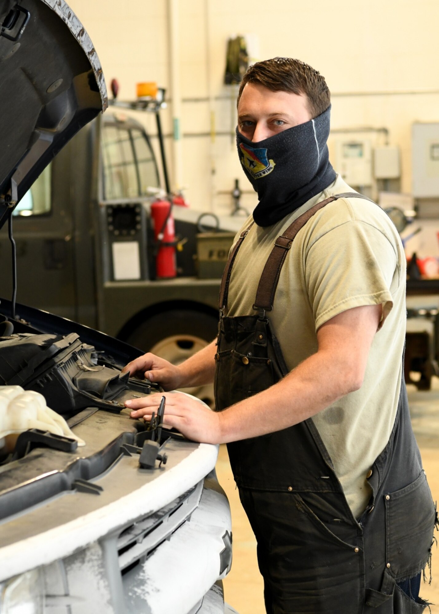 Tech. Sgt. Garrett Goguen 104th Logistics Readiness Squadron Vehicle work leader works to mantain the engine of a truck at Barnes Air National Guard Base, October 16, 2020.