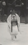 Mary Lohnes at 18, wearing traditional Native American Regalia, prior to joining the Army