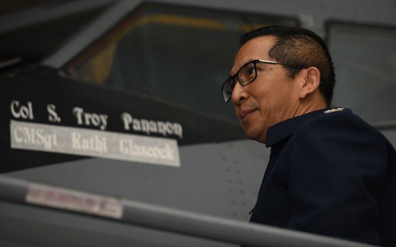 U.S. Air Force Col. Troy Pananon, 100th Air Refueling Wing commander, prepares to unveil the name of Chief Master Sgt. Kathi Glascock, 100th ARW command chief, on a KC-135 Stratotanker aircraft at Royal Air Force Mildenhall, England, Oct. 29, 2020. The stenciling of pilot names on aircraft started shortly before World War II before expanding further. (U.S. Air Force photo by Staff Sgt. Anthony Hetlage)