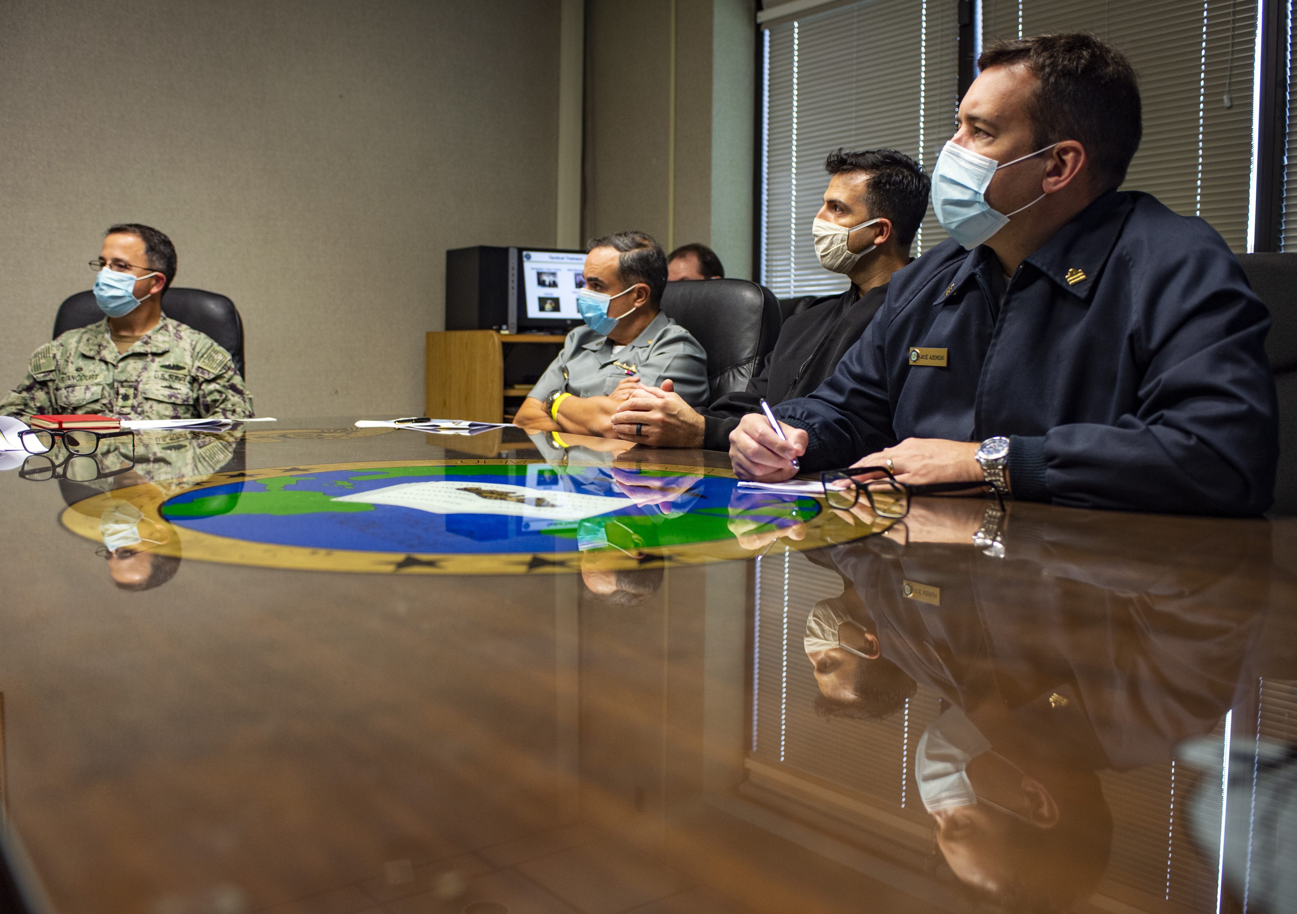 Cmdr. Richard Bentancourt, left, commanding officer of Submarine Learning Facility Norfolk (SLFN), briefs key leadership from the Brazilian Submarine Force at the SLFN headquarters building in Norfolk, Va. October 27, 2020.