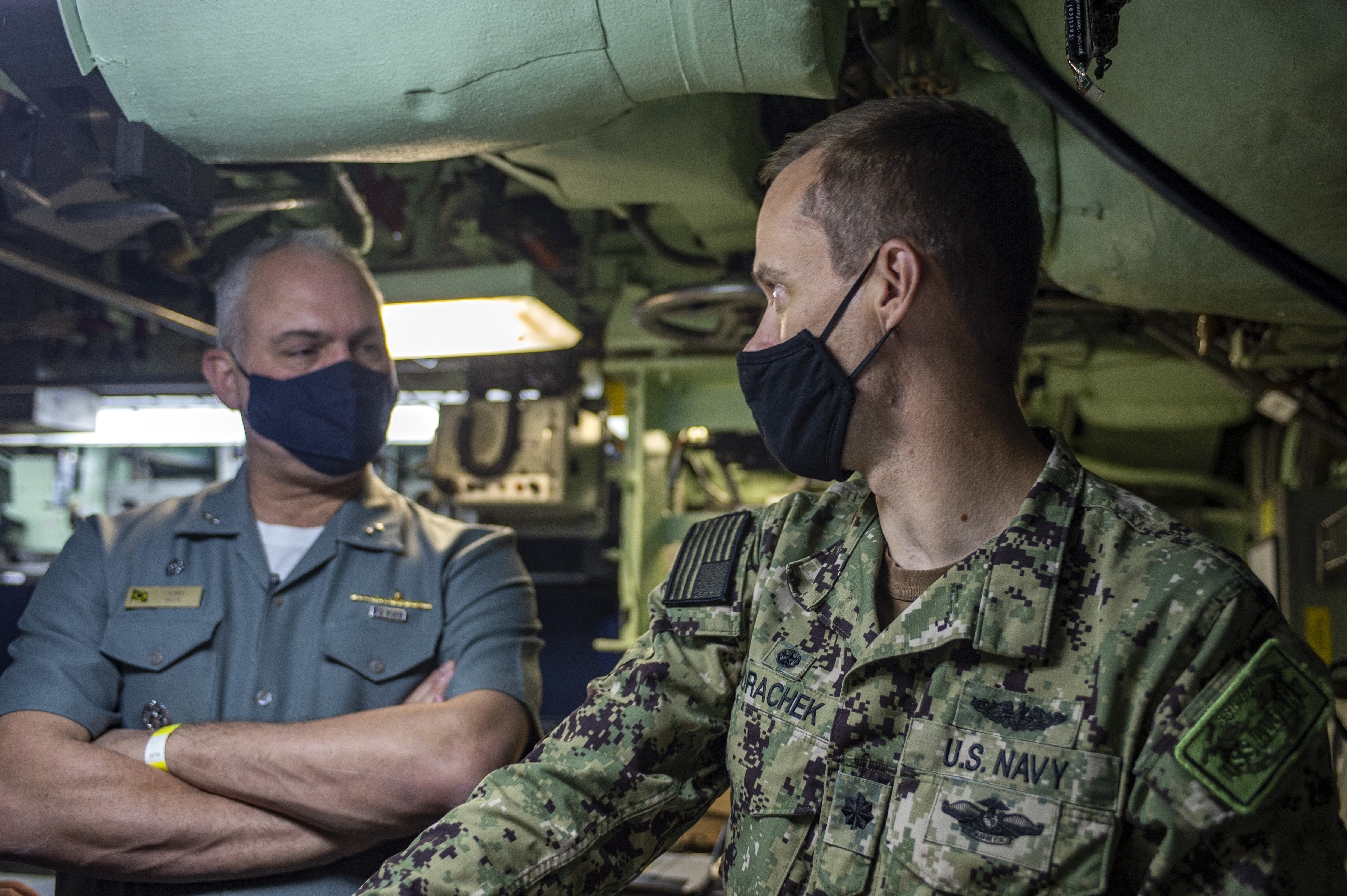 Cmdr. Mathias Vorachek, commanding officer of the Los Angeles-class attack submarine USS Albany (SSN 753), explains operations in the control to Rear Adm. Thadeu Lobo, commander, Brazilian Submarine Force, at Naval Station Norfolk, Oct. 27, 2020.