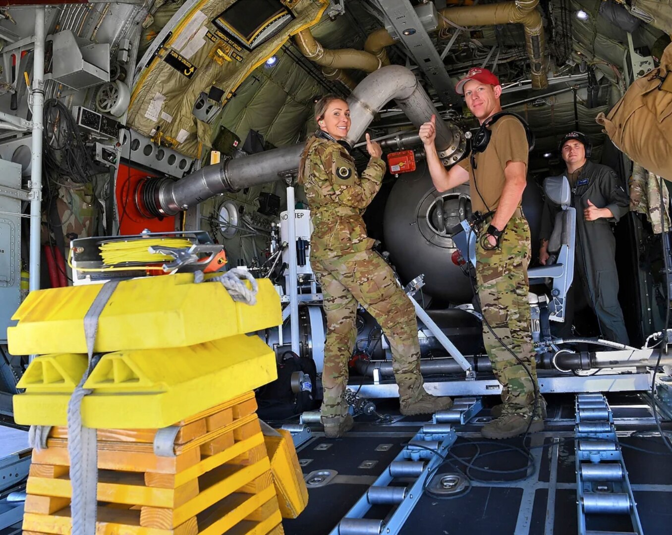 A crew from the 153rd Airlift Wing, Wyoming Air National Guard, gives a thumbs up signifying everything is operational during aerial wild land firefighting training June 15-19, 2020, at McClellan Air Base in Sacramento, California.