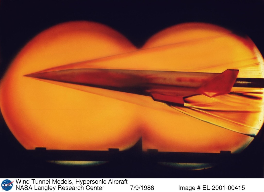Hypersonic model vehicle flies in a wind tunnel.