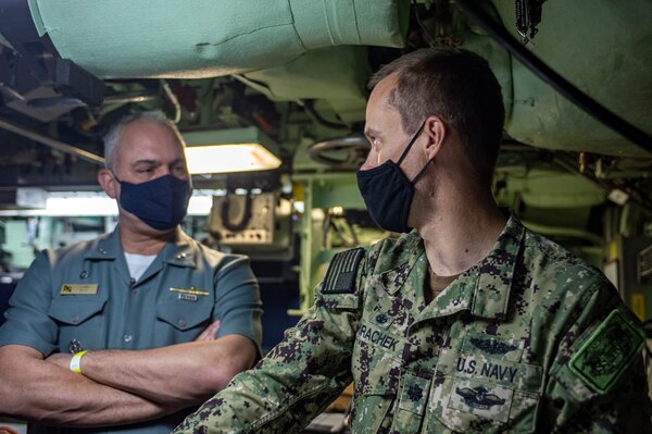 Cmdr. Mathias Vorachek, commanding officer of the Los Angeles-class attack submarine USS Albany (SSN 753), explains operations in the control to Rear Adm. Thadeu Lobo, commander, Brazilian Submarine Force, at Naval Station Norfolk, Oct. 27, 2020.