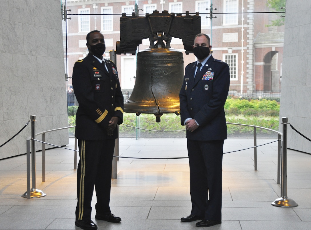 DLA Troop Support Commander Army Brig. Gen. Gavin Lawrence, left, and Clothing and Textiles Director Col. Justin Swartzmiller, right pose at the Liberty Bell Center in Philadelphia during a promotion ceremony in Swartzmiller’s honor October 28, 2020. Swartzmiller was also by family members at the socially distanced ceremony.
