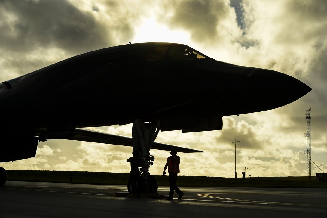 Two crew chiefs with the 9th Expeditionary Bomb Squadron get ready to perform post-flight aircraft inspections with B-1B Lancer aircrew during a Bomber Task Force deployment at Andersen Air Force Base, Guam, Oct. 25, 2020.