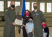 Maj. Chad Swinehart, second from right, 6th Attack Squadron director of operations, poses with his family and Col. Ryan Keeney, left, 49th Wing commander, Oct. 26, 2020, during a Bronze Star Medal presentation on Holloman Air Force Base, New Mexico. Swinehart was awarded the Bronze Star Medal due to his meritorious achievements during his time deployed as the director of operations and air advisor of the 370th Air Expeditionary Advisory Group, 370th Air Expeditionary Advisory Squadron and the 321st Air Expeditionary Wing. (U.S. Air Force photo by Senior Airman Collette Brooks)