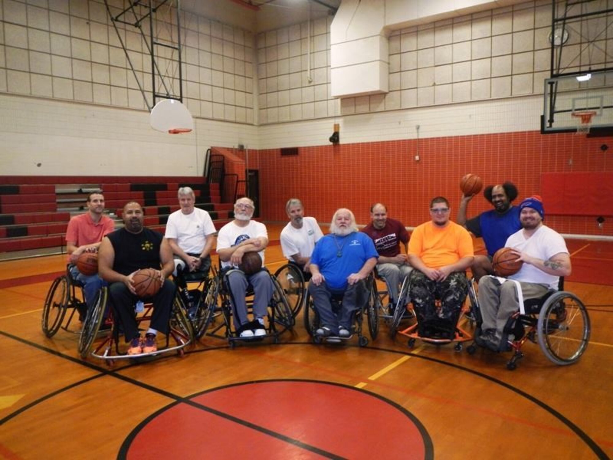 The RTI-Wheelin' Wildcats wheelchair basketball team poses for a group photo.