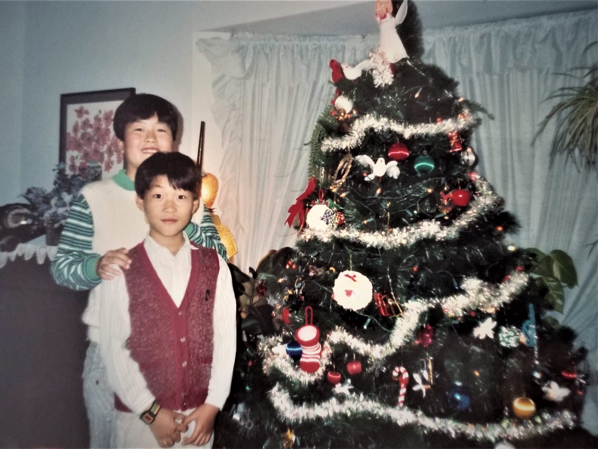 Maj. Jay Park, director of operations for Air Force Recruiting Service’s Detachment 1, with his brother Jake, celebrating their first Christmas in the United States after his parents immigrated here in 1990 to give him and his brother a better life.
