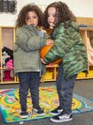 Phoenix, 3, left, and Axton, 5, carry a pumpkin during the 50th Force Support Squadron’s pumpkin patch event at the Child Development Center Oct. 23, 2020, at Schriever Air Force Base, Colorado. The CDC held the pumpkin patch indoors to accommodate for inclement weather. The children selected a pumpkin to take home and decorate. (U.S. Space Force photo by Marcus Hill)