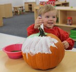 Tucker, 2, paints his pumpkin Oct. 23, 2020, at Schriever Air Force Base, Colorado. The 50th Force Support Squadron provided pumpkins to Team Schriever members as part of their planned activities for Halloween. (U.S. Space Force photo by Marcus Hill)
