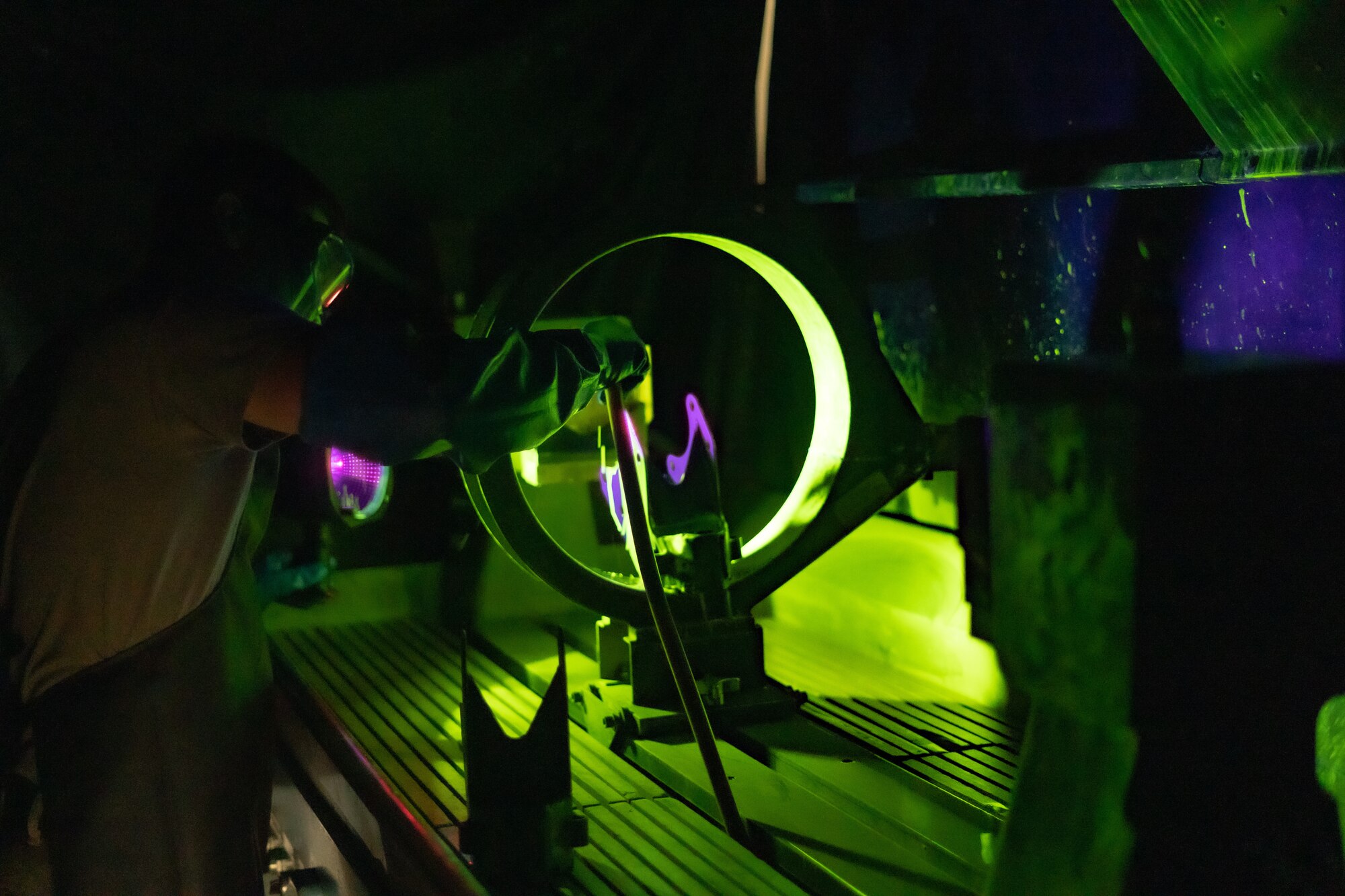 An Airman conducts a magnetic particle test
