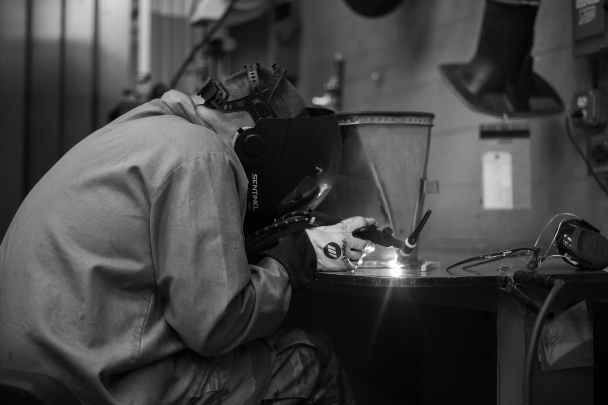 An Airmen practices welding