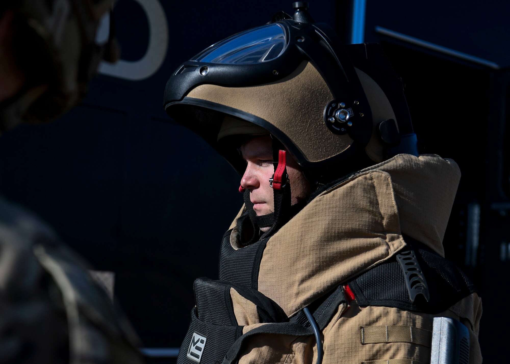 EOD NCO dons personal protective gear