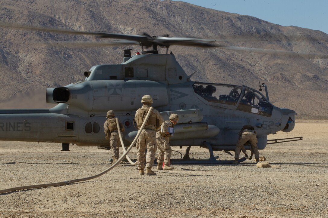 U.S. Marines with Marine Wing Support Squadron 373, Marine Aircraft Group 16, 3rd Marine Aircraft Wing, refuel a Bell AH-1Z Viper during Integrated Training Exercise 1-21 at Marine Corps Air Ground Combat Center, Twentynine Palms, California, Oct. 22, 2020. ITX is the most comprehensive training conducted at MCAGCC and focuses on the tactical application of combined-arms maneuver, offensive and defensive operations during combat. (U.S. Marine Corps photo by Lance Cpl. Gustavo Romero)