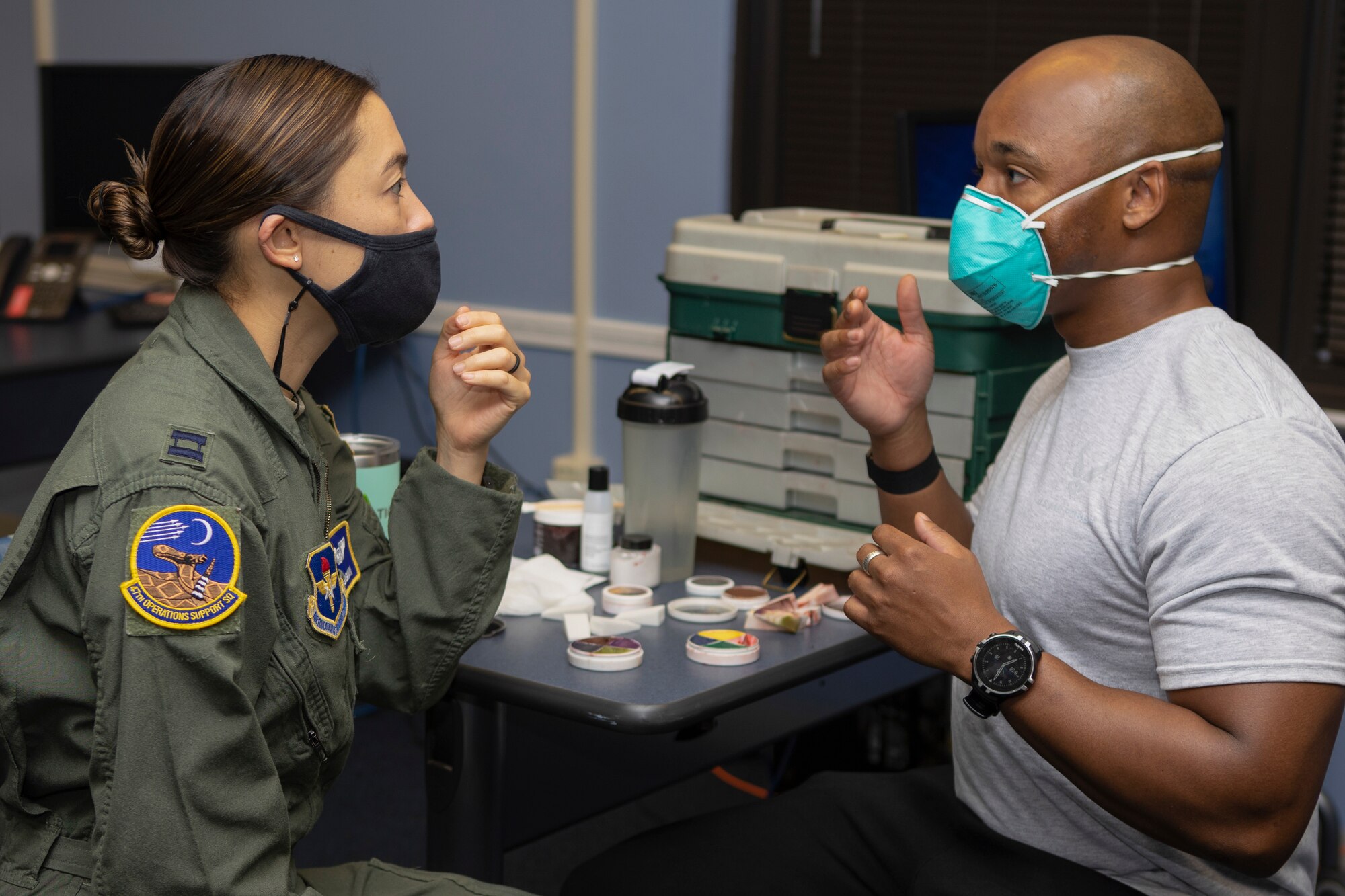 Staff Sgt. Cameron Chisolm, 47th Operations Support Squadron Aerospace & Physiology NCO in charge of administration and scheduling, applies moulage to Capt. Ally Bergman, 47th Operations Support Squadron Aerospace & Physiology Flight commander, on Oct. 27, 2020 at Laughlin Air Force Base, Texas. Bergman was one of numerous people from across base who wore a made-up bruise for the Black Eye Campaign to bring focus to Domestic Violence Awareness Month. (Courtesy Photo)