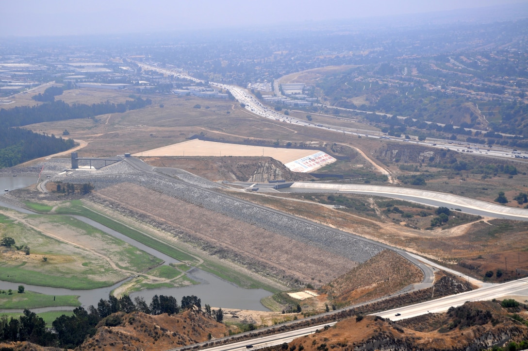 Prado Dam, located in Corona, California, can be seen from a helicopter in this undated aerial photo. The U.S. Army Corps of Engineers Los Angeles District and the Orange County Flood Control District recently signed an amendment to use Bipartisan Budget Act of 2018 funds for select features of the Santa Ana River Mainstem project, which include raising the Prado Dam spillway by 20 feet; completing the lower Norco Bluffs toe protection project, and the Alcoa Phase 2 and River Road dikes; and ongoing mitigation responsibilities associated with the Prado Dam project features.