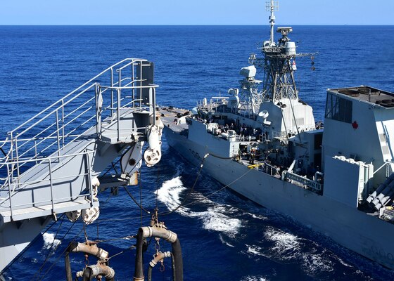PHILIPPINE SEA (Oct. 25, 2020) – The U.S. Navy Military Sealift Command Henry J. Kaiser-class fleet replenishment oiler USNS Tippecanoe (T-AO 199), left, refuels the Royal Canadian Navy Halifax-class frigate HMCS Winnipeg (FFH 338) during an underway replenishment prior to participating in Keen Sword. Keen Sword is a joint, bilateral, biennial field-training exercise involving U.S. military and Japan Self-Defense Force personnel, designed to increase combat readiness and interoperability of the Japan-U.S. alliance. (US. Navy photo by Christopher Bosch)