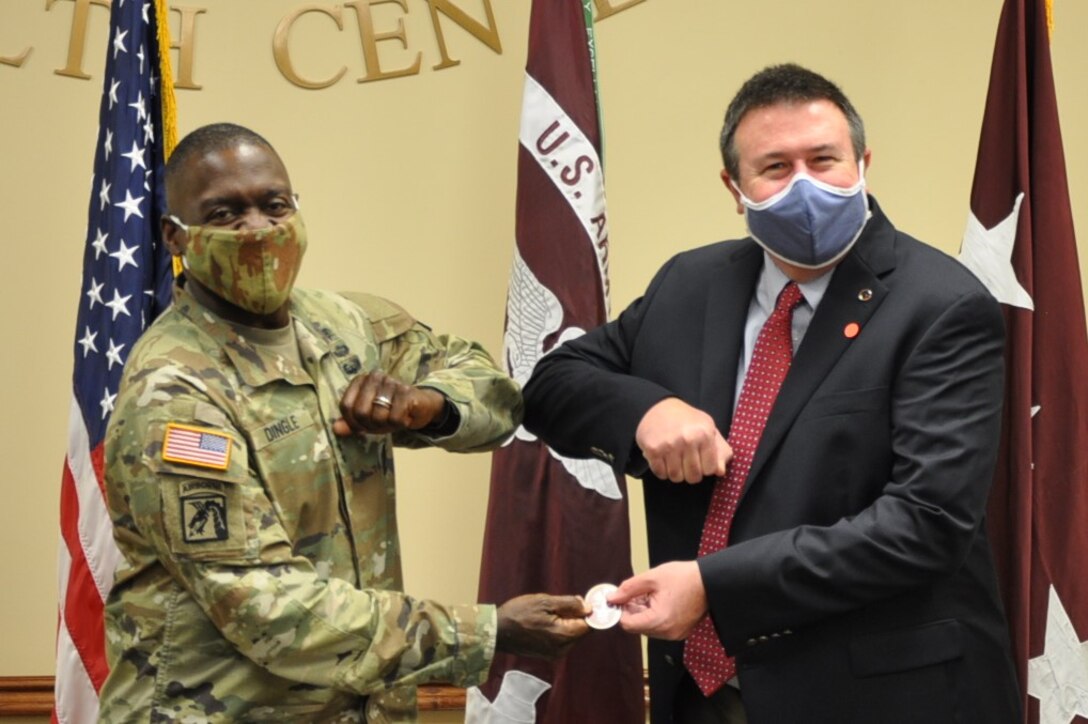 During a visit to Fox Army Health Center at Redstone Arsenal Tuesday, Lt. Gen. R. Scott Dingle, U.S. Army Surgeon General, took the time to recognize members of the U.S. Army Engineering and Support Center, Huntsville’s Medical Division, including Wes Turner, Medical Division chief.