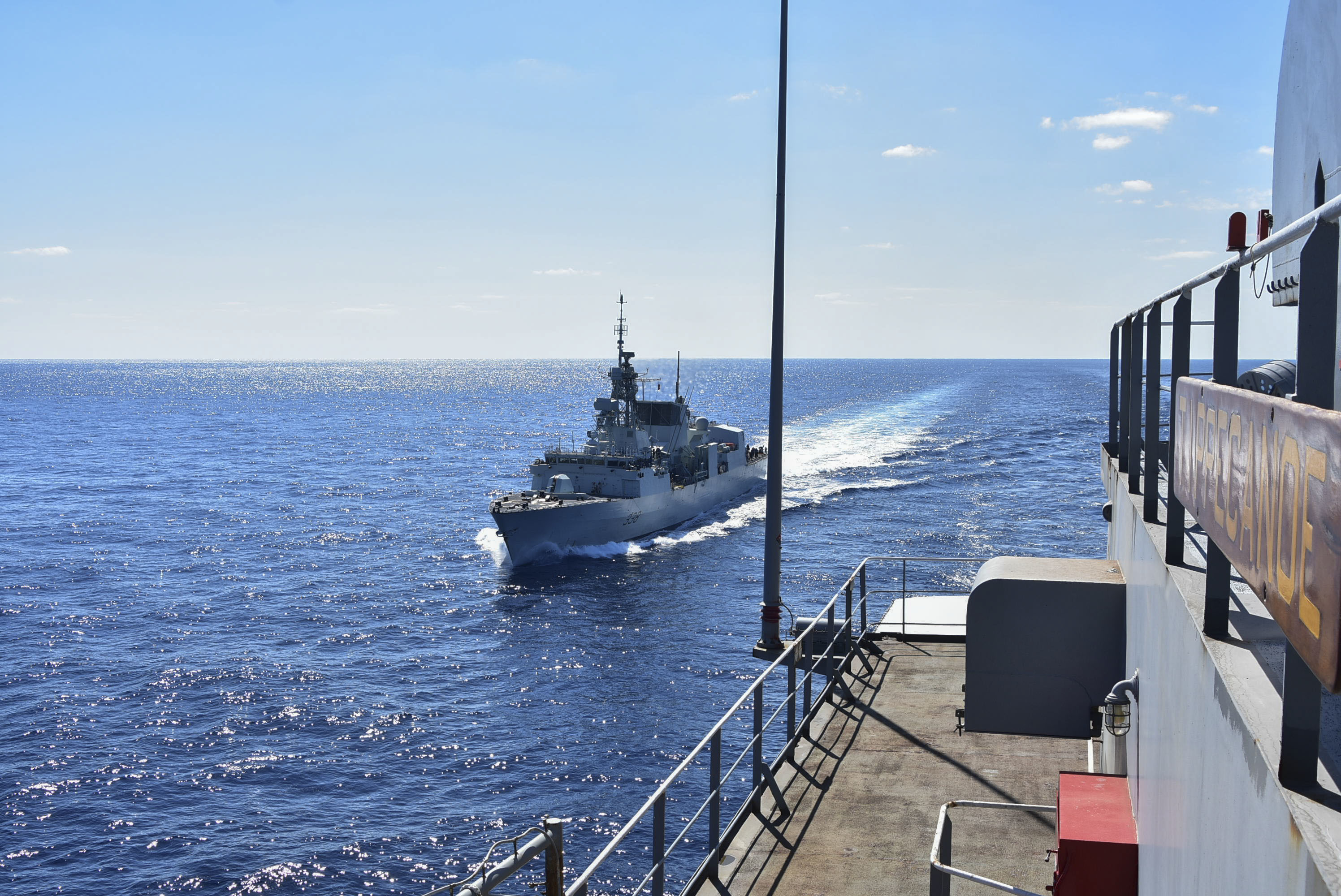 PHILIPPINE SEA (Oct. 25, 2020) – The Royal Canadian Navy Halifax-class frigate HMCS Winnipeg (FFH 338) approaches the U.S. Navy Military Sealift Command Henry J. Kaiser-class fleet replenishment oiler USNS Tippecanoe (T-AO 199) in preparation for an underway replenishment prior to participating in Keen Sword. Keen Sword is a joint, bilateral, biennial field-training exercise involving U.S. military and Japan Self-Defense Force personnel, designed to increase combat readiness and interoperability of the Japan-U.S. alliance. (US. Navy photo by Christopher Bosch)