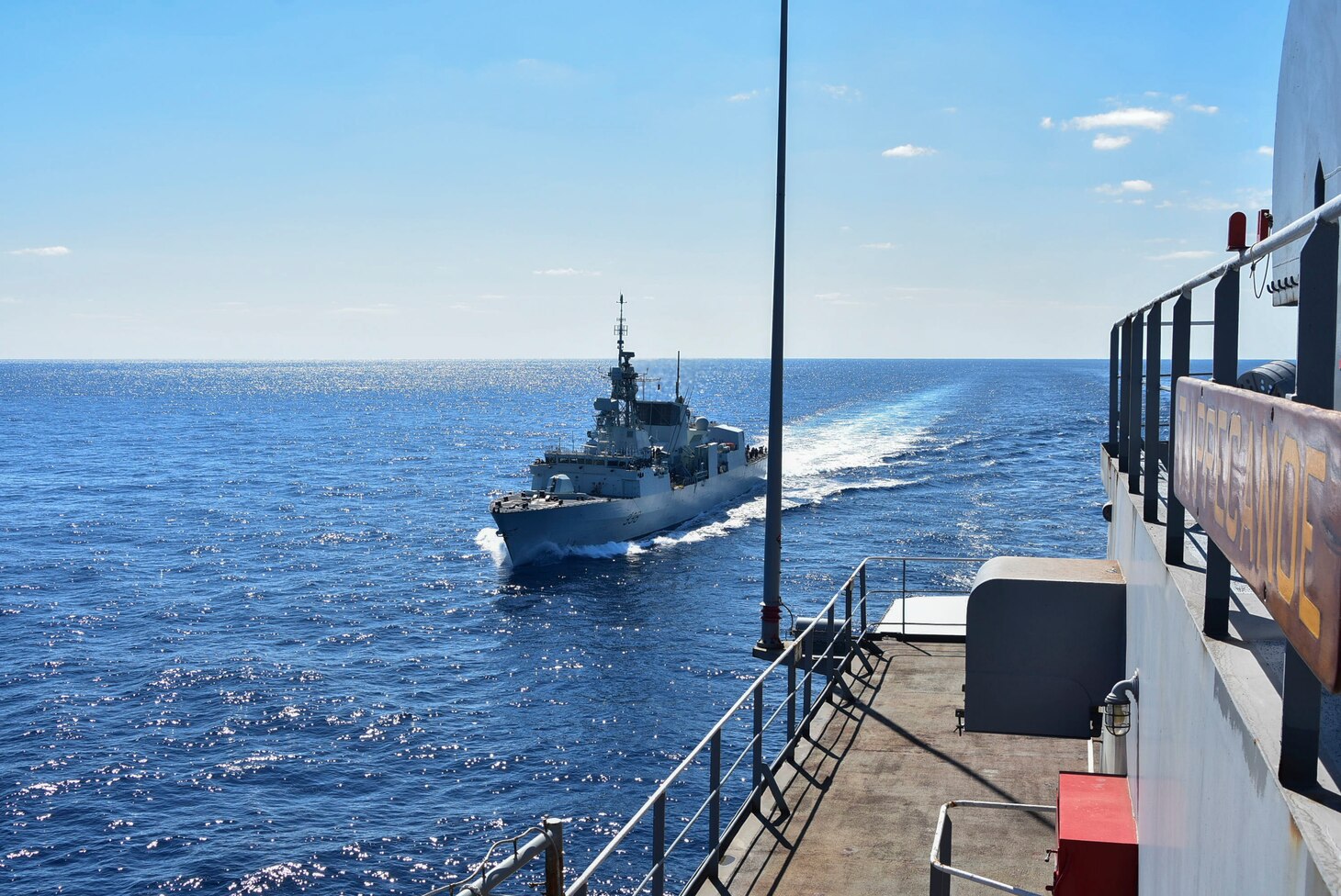 PHILIPPINE SEA (Oct. 25, 2020) – The Royal Canadian Navy Halifax-class frigate HMCS Winnipeg (FFH 338) approaches the U.S. Navy Military Sealift Command Henry J. Kaiser-class fleet replenishment oiler USNS Tippecanoe (T-AO 199) in preparation for an underway replenishment prior to participating in Keen Sword. Keen Sword is a joint, bilateral, biennial field-training exercise involving U.S. military and Japan Self-Defense Force personnel, designed to increase combat readiness and interoperability of the Japan-U.S. alliance. (US. Navy photo by Christopher Bosch)