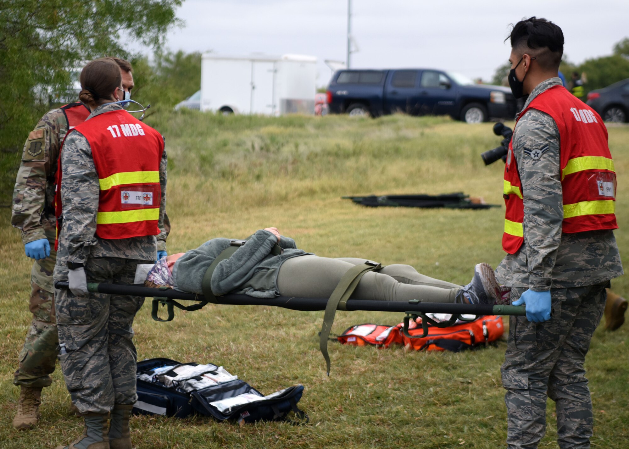 17th Medical Group medics carry a patient on a stretcher to the triage to be treated during the Ready Eagle exercise on Goodfellow Air Force Base, Texas, Oct. 23, 2020. Patients were sorted by the severity of injuries and treated quickly. (U.S. Air Force photo by Airman 1st Class Ethan Sherwood)