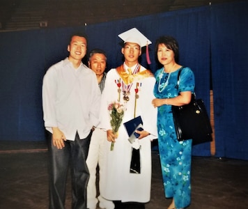 Maj. Jay Park, director of operations for Air Force Recruiting Service’s Detachment 1, after his high school graduation in Moore, Oklahoma with his father, mother and brother.