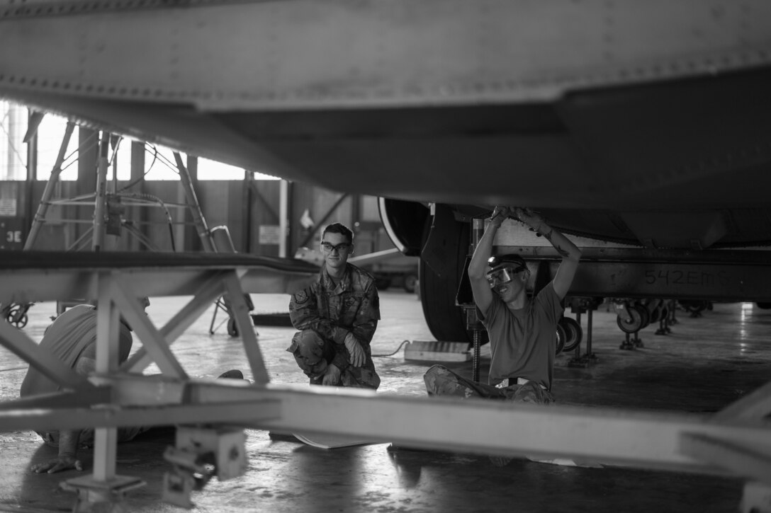 Airmen work on a C-130