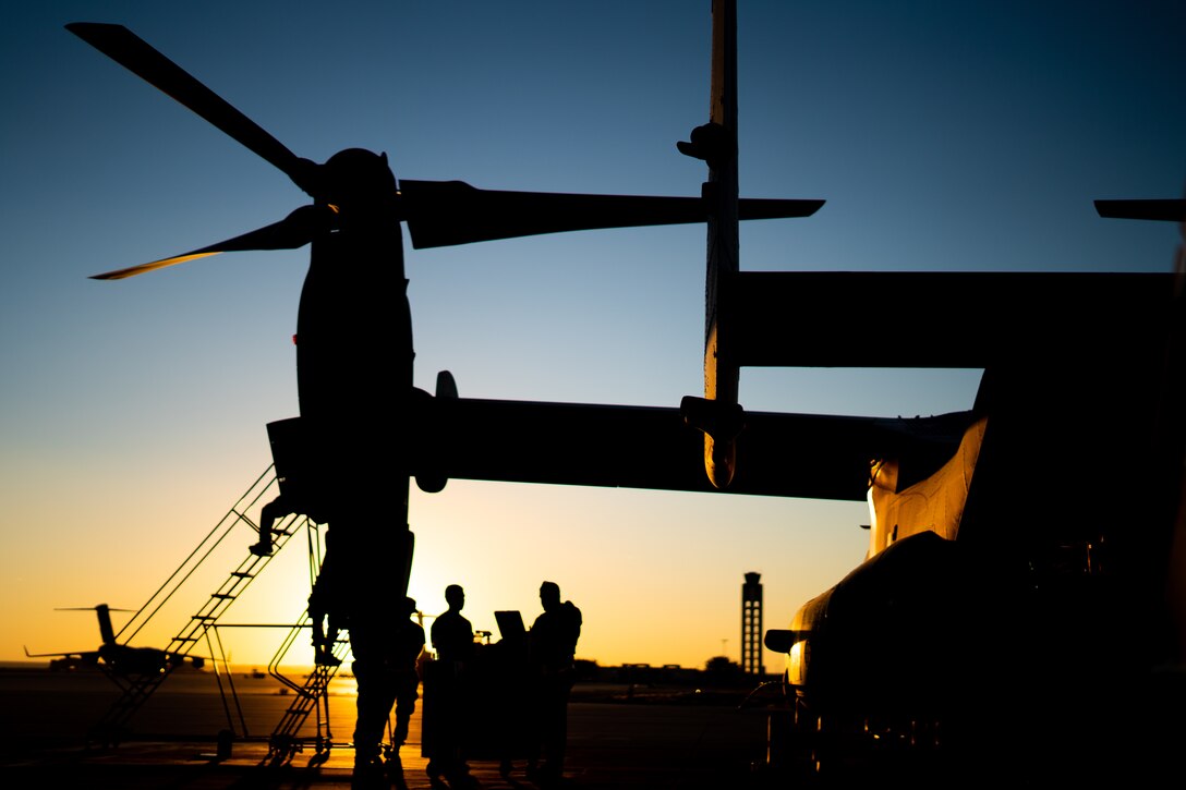 Airmen work on a CV-22 Osprey