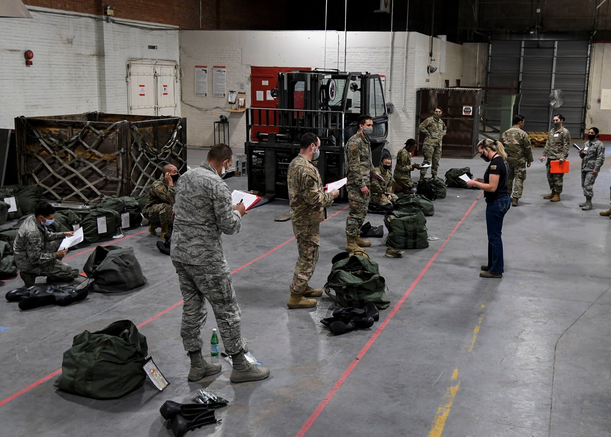 Airmen check equipment before deployment.