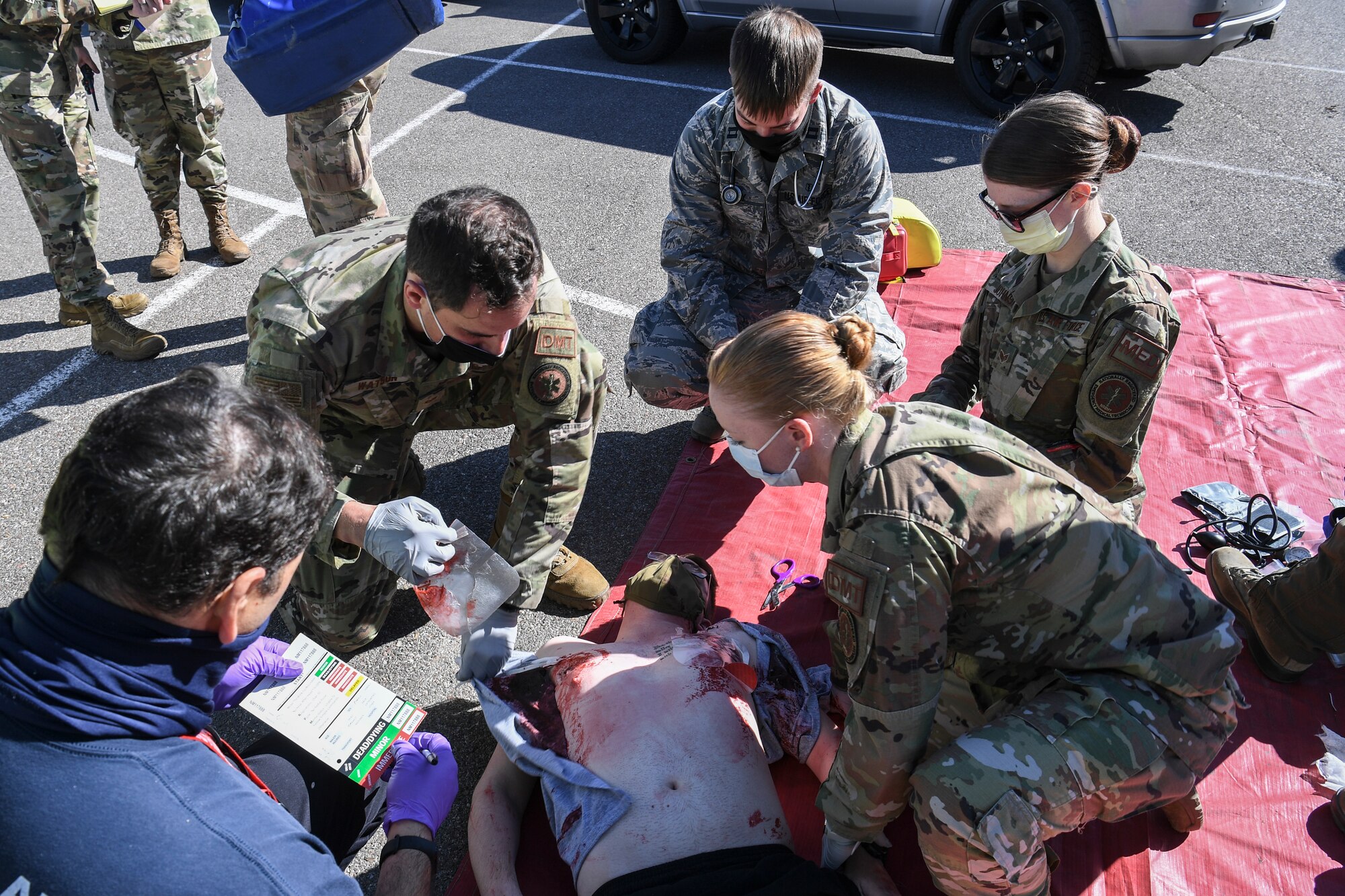Medical officials perform triage for casualties.