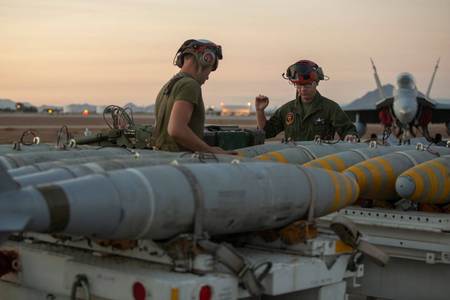 Marines load live ordnance at Naval Air Facility El Centro, California.