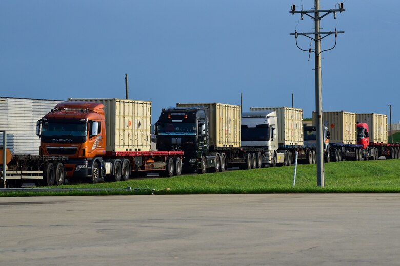 Trucks loaded with munition containers wait in line at Kunsan Air Base, Republic of Korea, Aug. 28, 2020. These unserviceable munitions will be transported to Jinhae seaport for shipment back to the United States, freeing up crucial storage for resupply that increases mission readiness capabilities of the 8th Fighter Wing. (U.S. Air Force photo by Senior Airman Jessica Blair). (U.S. Air Force photo by Senior Airman Jessica Blair)