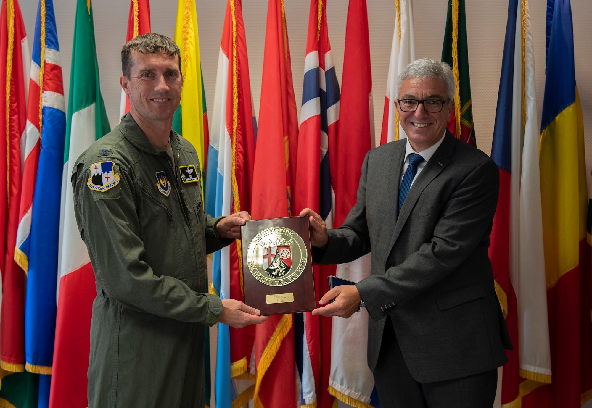 U.S. Air Force Col. David Epperson, 52nd Fighter Wing Commander, receives a plaque from Roger Lewentz, Minister of the Interior for the State of Rheinland-Pfalz, at Spangdahlem Air Base, Germany, Aug. 28, 2020. Lewentz gave the plaque to Epperson as appreciation of the friendship and partnership between the 52nd FW and Rheinland-Pfalz. (U.S. Air Force photo by Airman 1st Class Alison Stewart)