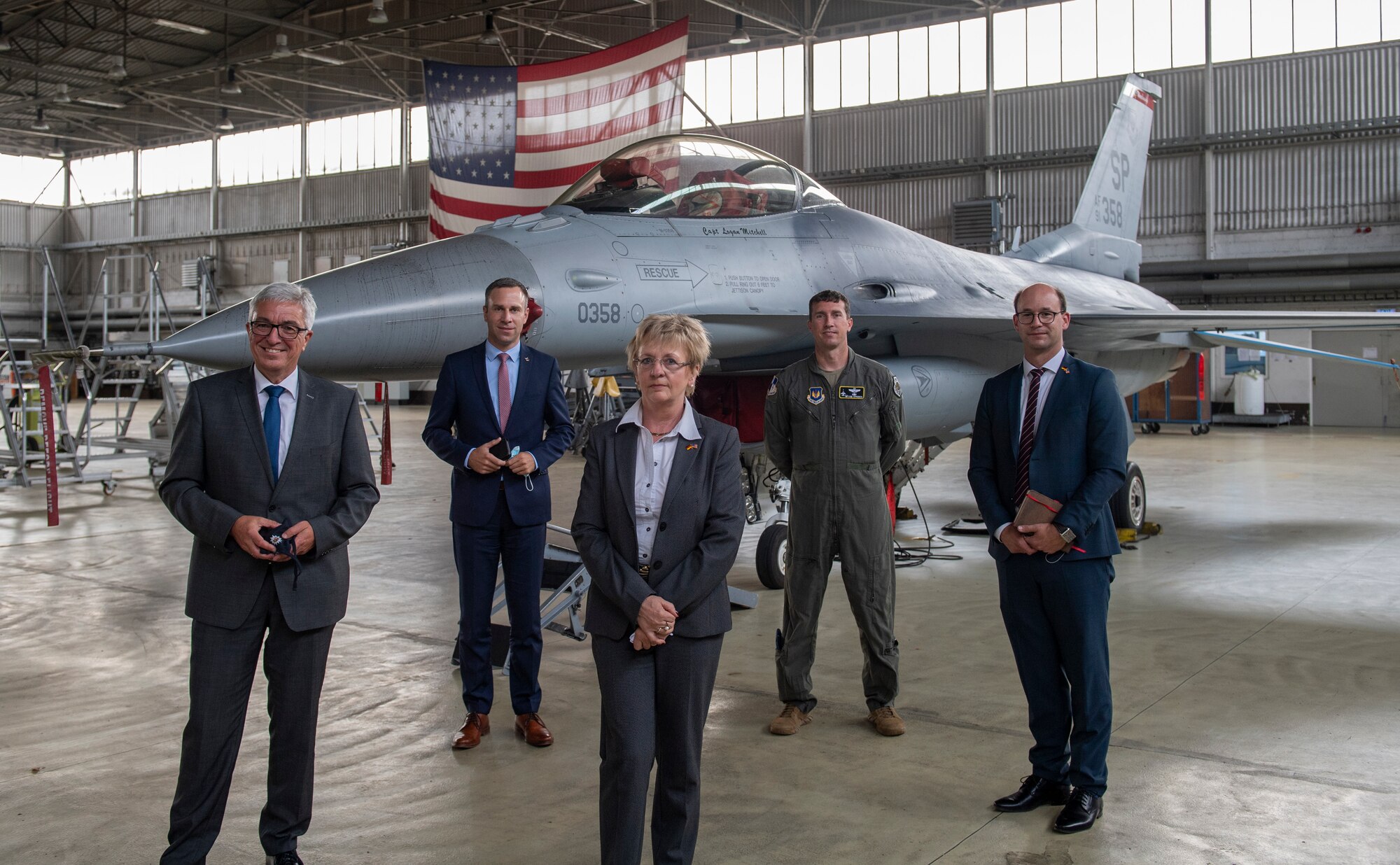 From left to right, Roger Lewentz, Minister of the Interior for the State of Rheinland-Pfalz, Nico Steinbach, state parliamentarian, Ruth Marx, director of community development, U.S. Air Force Col. David Epperson, 52nd Fighter Wing commander, and Carsten Goeller, section leader for military forces, pose for a photo in front of an F-16 Fighting Falcon at Spangdahlem Air Base, Germany, Aug. 28, 2020. Lewentz and his team toured the base and expressed their appreciation for the friendship established between Rheinland-Pfalz and Spangdahlem AB. (U.S. Air Force photo by Airman 1st Class Alison Stewart)