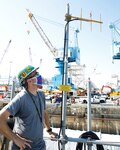 Electronics Mechanic Anthony Qualtieri stands with one of the Yagi antennas installed on the USS San Francisco (SSN 711).