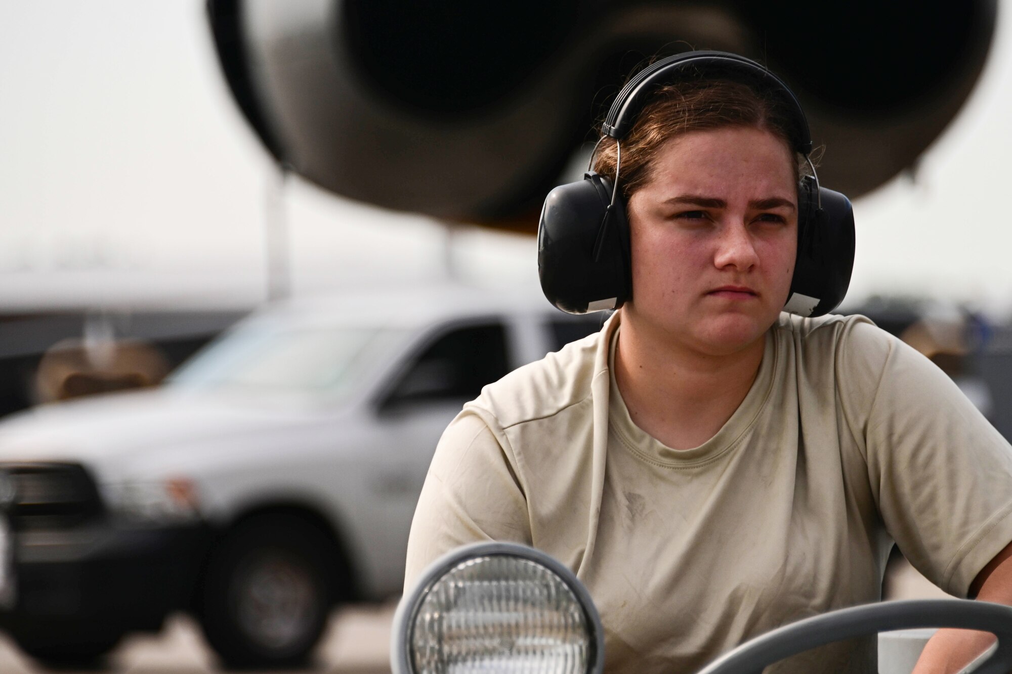 Photo of Airman driving a munitions loader