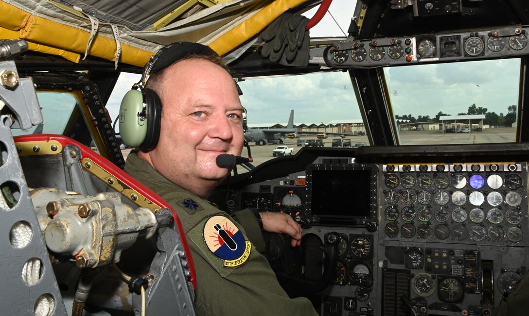 Photo of pilot smiling in cockpit of a B-52.