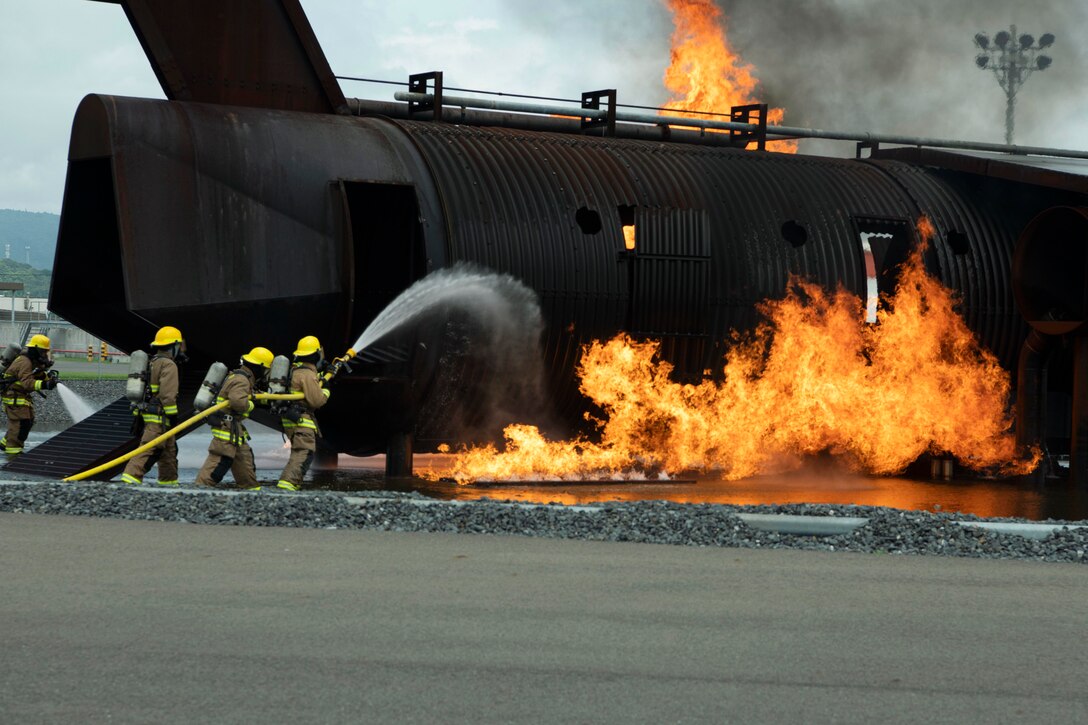 Marines put out a fire.