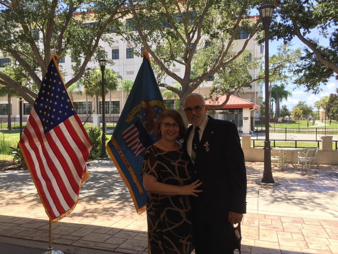 Honoree and wife pose for a photo.