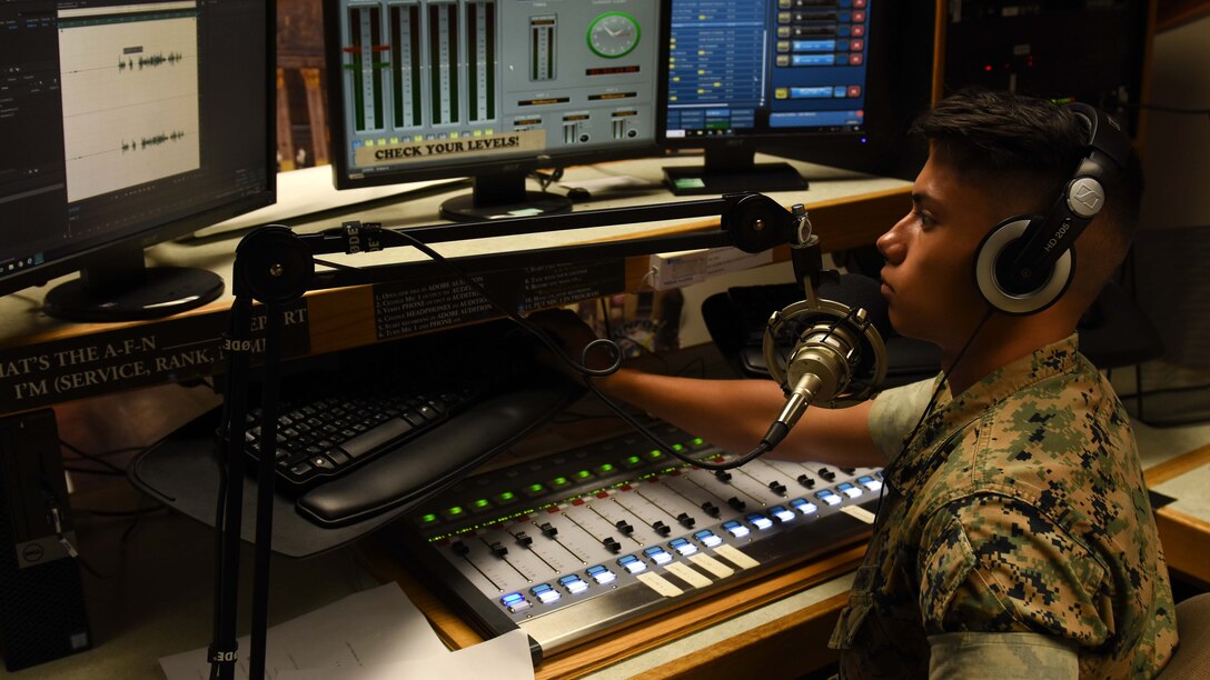 A DINFOS student trains in the school's radio studio.