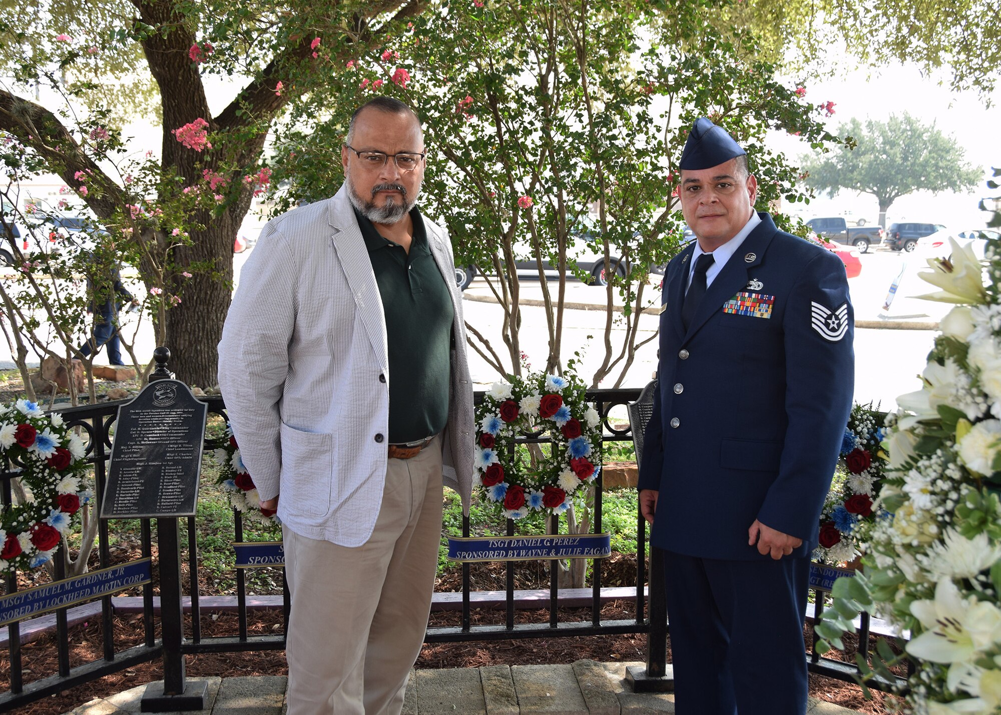 John P. Perez and brother, Tech. Sgt. Joe Perez, 26th Aerial Port Squadron ramp service supervisor, pause for a moment after laying a wreath on the BRAVO-12 memorial during a remembrance ceremony Aug. 28, 2020 at Joint Base San Antonio-Lackland, Texas.