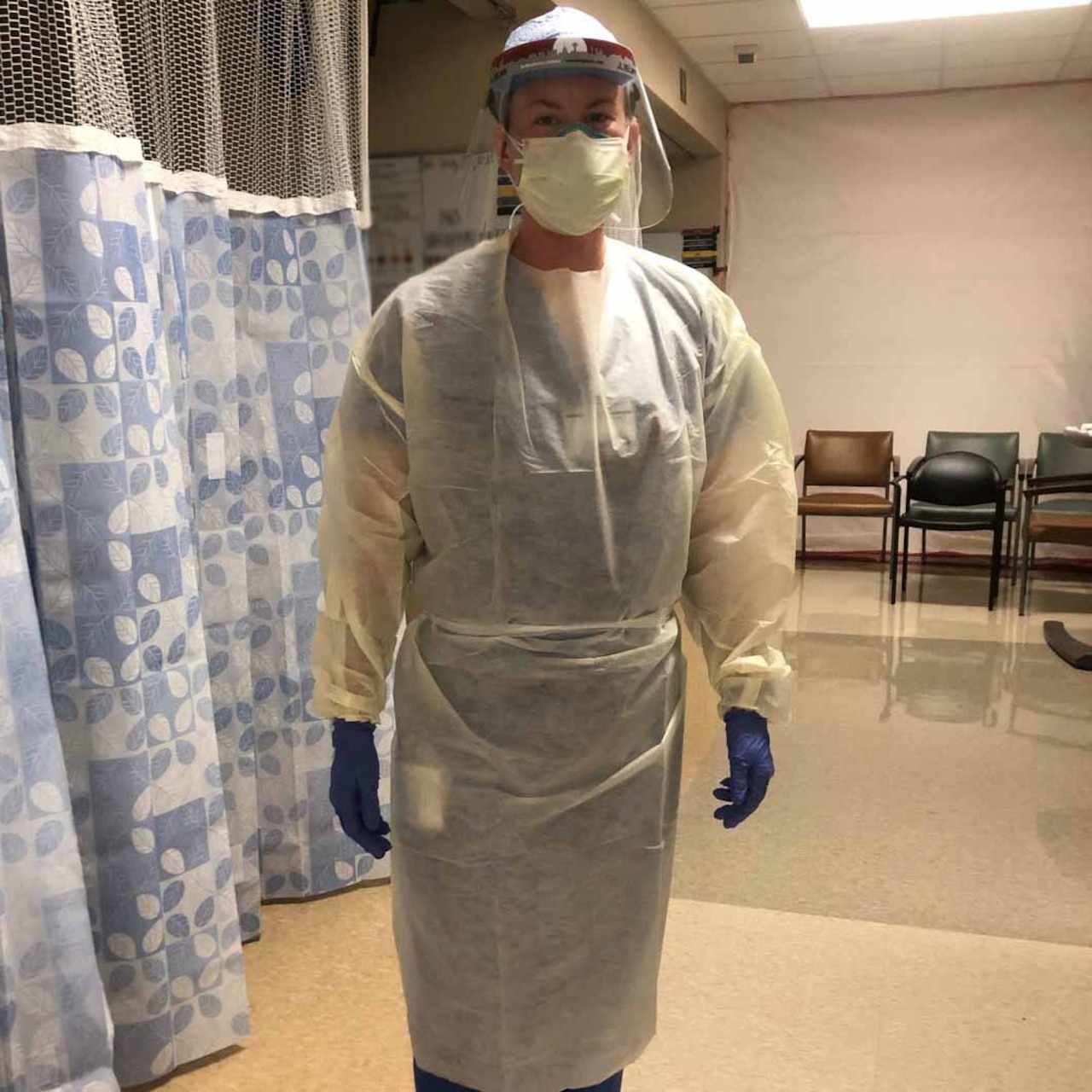 A critical care nurse wearing personal protective equipment.