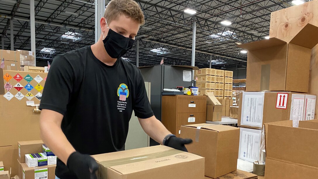 DLA Distribution employees package N95 masks for nationwide distribution to nursing homes
