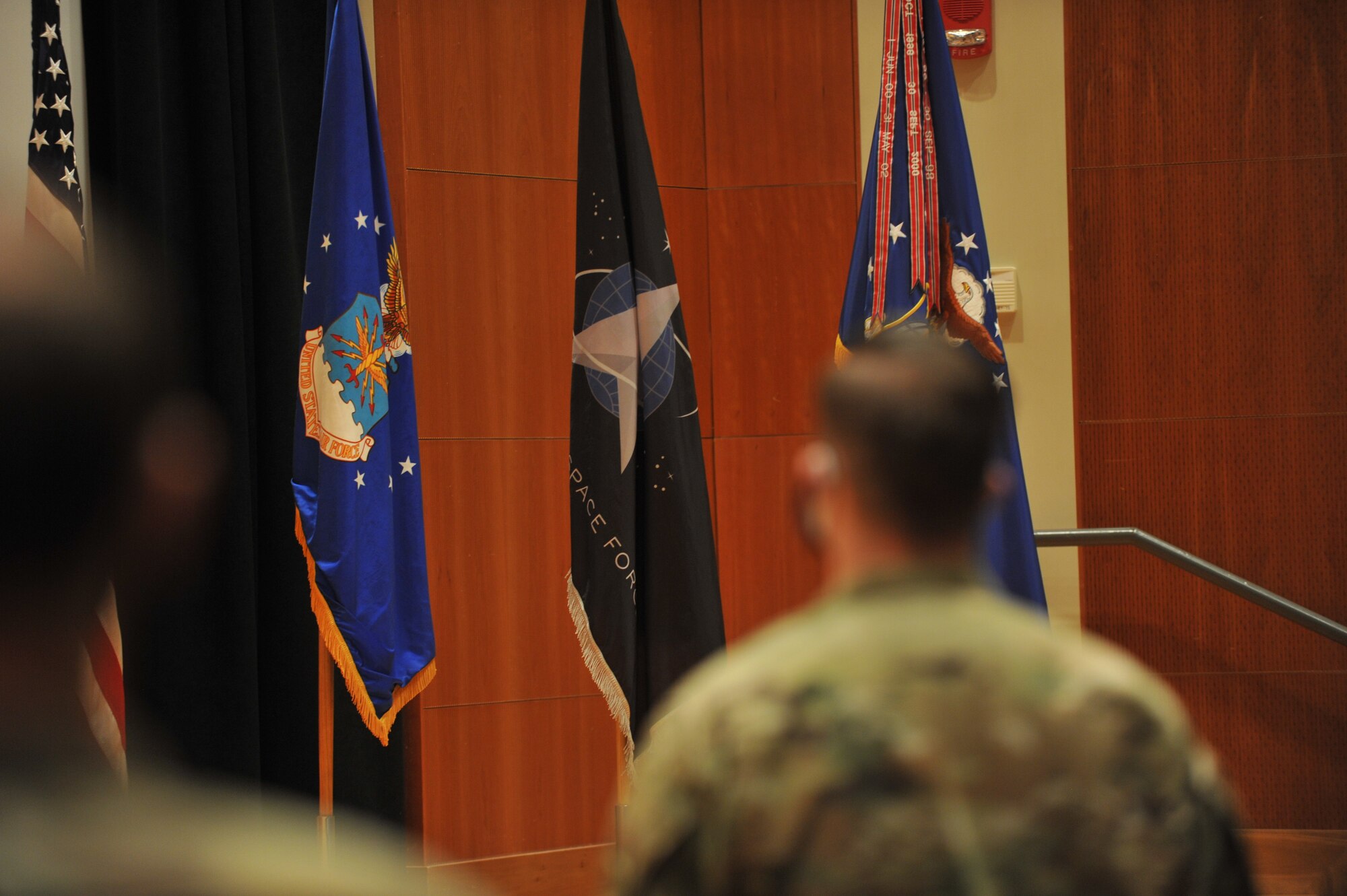 the first time ever, the U.S. Space Force is on display in the Benson Auditorium at the National Air and Space Intelligence Center. The flag was used during a Sept. 1 ceremony honoring nine NASIC members who transferred from the U.S. Air Force to the U.S. Space Force. These space professionals are among the first of more than 2,400 personnel expected to transfer beginning in September and continuing throughout the fall. (U.S. Air Force photo by Staff Sgt. Andrew Moore)