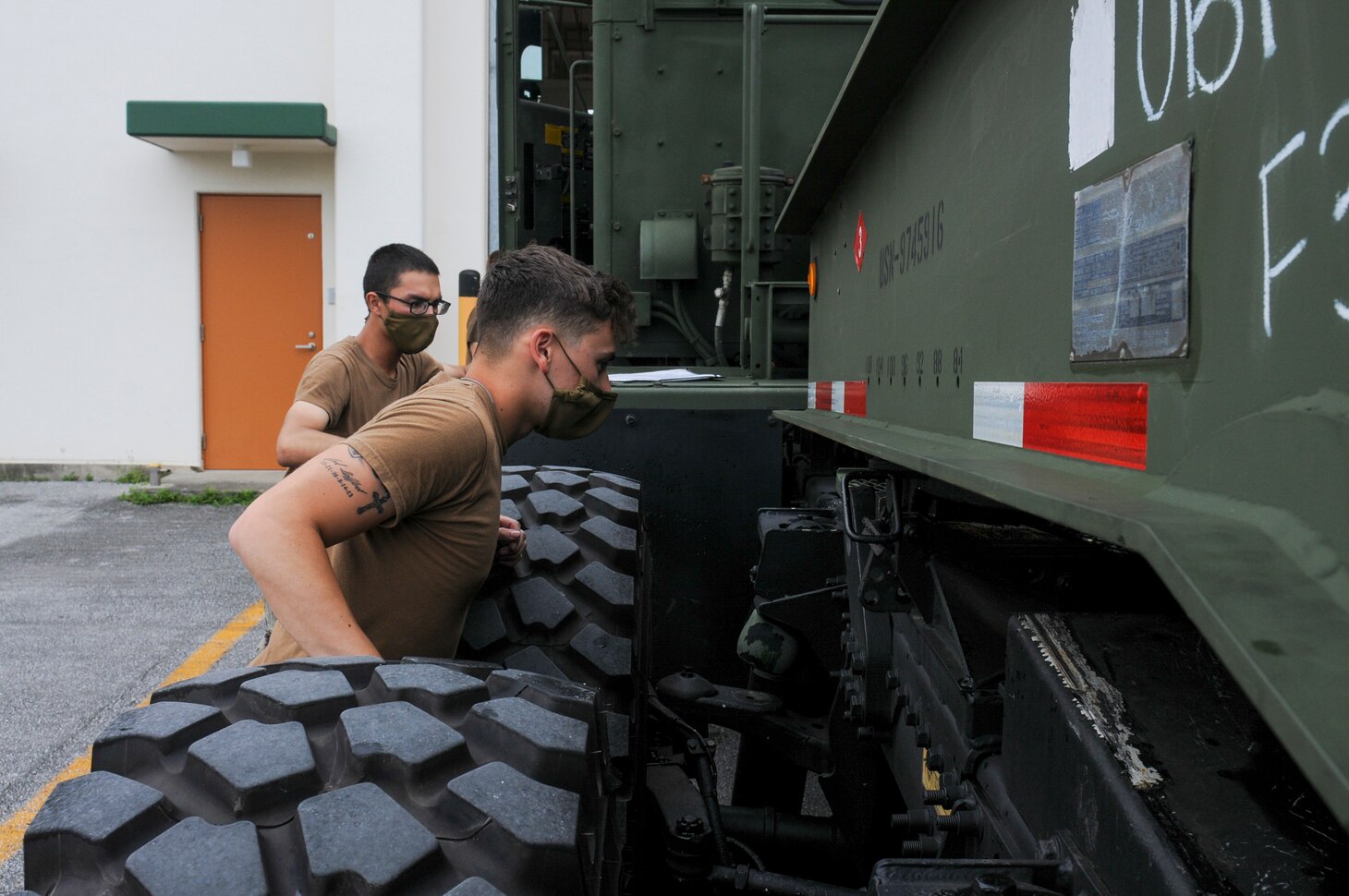200825-N-TP832-1293 OKINAWA, Japan (Aug. 25, 2020) Construction Mechanic Constructionman Mark Clifford, from Winfield, Kan., and Construction Mechanic Constructionman Jose Ligorria, from Laurel, Md., assigned to U.S. Naval Mobile Construction Battalion (NMCB) 3, inspect a MK31 medium tactical vehicle replacement truck during a 48-hour mount out exercise on board Camp Shields in Okinawa, Japan. NMCB-3 is deployed across the Indo-Pacific region conducting high-quality construction to support U.S. and partner nations to strengthen partnerships, deter aggression, and enable expeditionary logistics and naval power projection. The battalion stands ready to complete assigned tasking, support Humanitarian Aid/Disaster Relief and Major Combat Operations throughout the area of responsibility. (U.S. Navy photo by Mass Communication Specialist 2nd Class Michael Lopez/Released)
