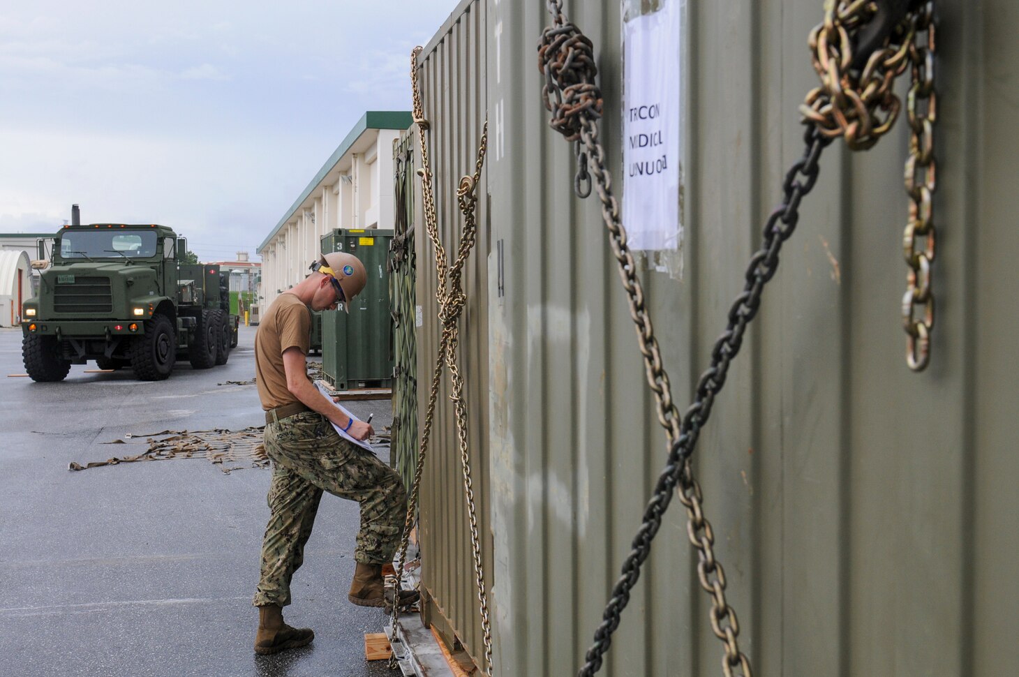 200826-N-TP832-1248 OKINAWA, Japan (Aug. 26, 2020) Construction Mechanic 3rd Class Kaine Schnagl, from Pillager, Min., assigned to U.S. Naval Mobile Construction Battalion (NMCB) 3, records the contents and weight of tricon storage containers during a 48-hour mount out exercise on board Camp Shields in Okinawa, Japan. NMCB-3 is deployed across the Indo-Pacific region conducting high-quality construction to support U.S. and partner nations to strengthen partnerships, deter aggression, and enable expeditionary logistics and naval power projection. The battalion stands ready to complete assigned tasking, support Humanitarian Aid/Disaster Relief and Major Combat Operations throughout the area of responsibility. (U.S. Navy photo by Mass Communication Specialist 2nd Class Michael Lopez/Released)